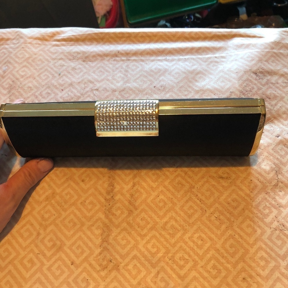 Sleek looking solid clutch , snap look, shoulder chain, elegant looking